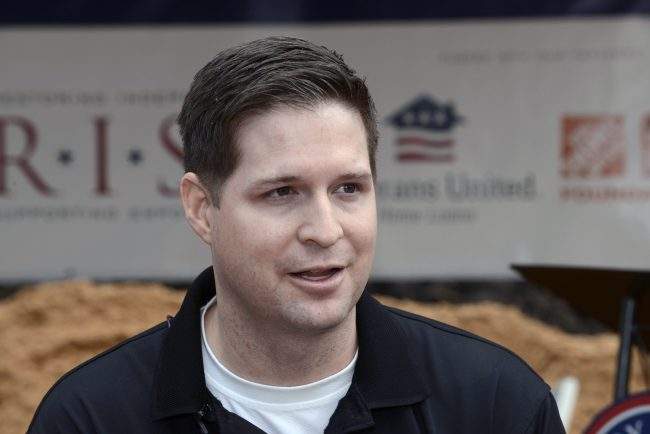 In this Jan. 14, 2016 photo, U.S. Air Force Sr. Airman (retired) Brian Kolfage, speaks with the media during a groundbreaking ceremony for a new home he and his family received through the Gary Sinise Foundation’s RISE program at Sandestin, Fla.