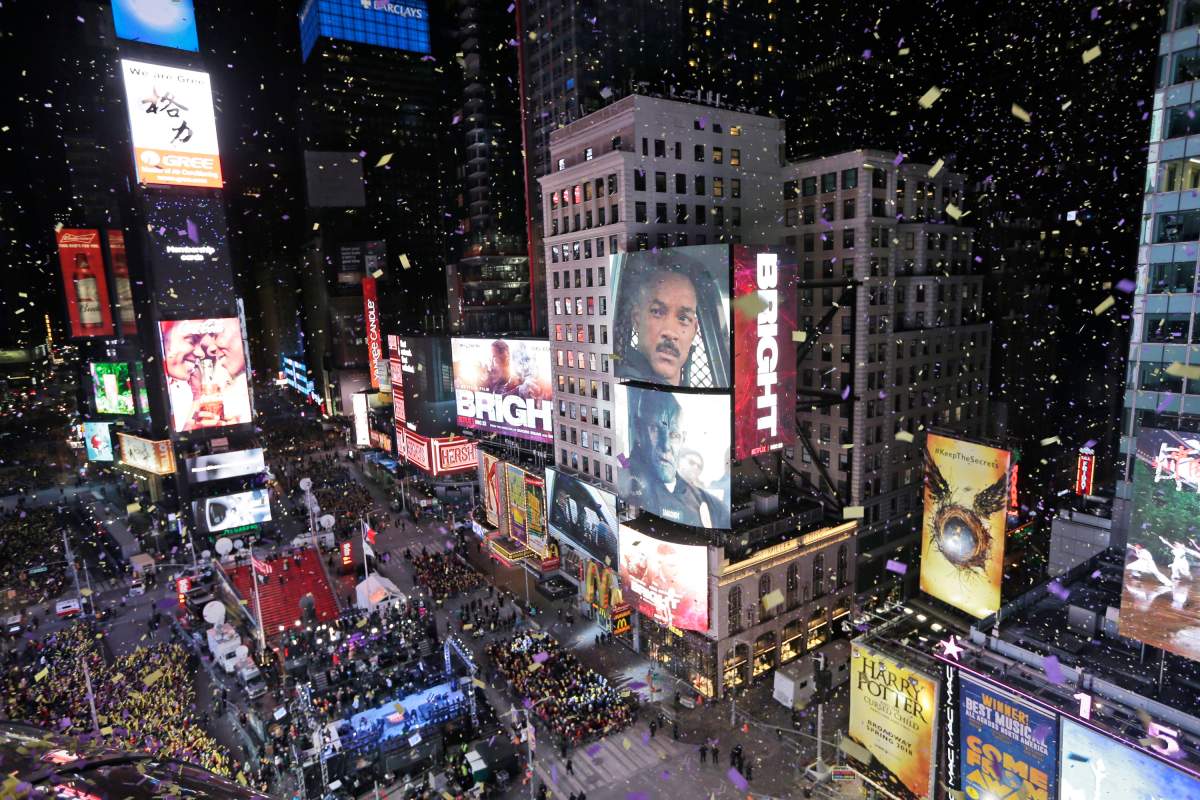 FILE - In this Jan. 1, 2018, file photo, confetti flies over Times Square during the New Year's celebration in New York.