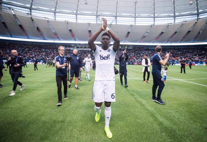 Vancouver Whitecaps midfielder Alphonso Davies salutes the crowd after playing his final match as a member of the MLS soccer team in Vancouver on October 28, 2018. 