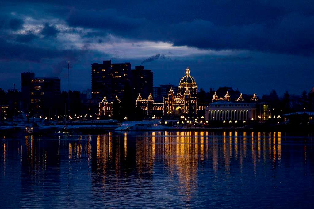 The British Columbia Legislature is reflected in the waters of Victoria harbour in the early morning in Victoria, B.C. Monday, Jan. 16, 2012.