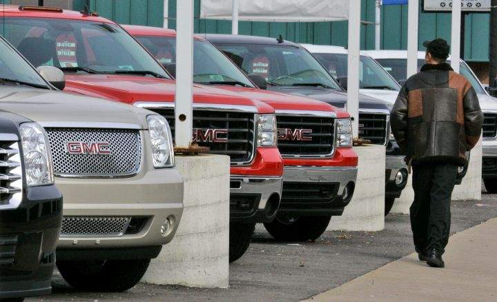 A file photo of SUVs on sale at a dealership. 