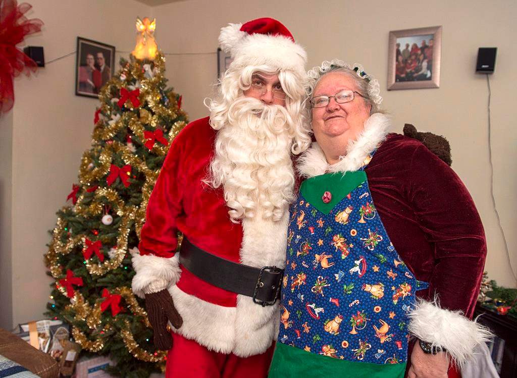 Ted Carroll, a Santa-for-hire, and his wife Kim, as Mrs. Claus, display their outfits in Halifax on Dec. 17, 2018. Professional Santas and their associates across the country are into the busy season as Christmas draws closer.