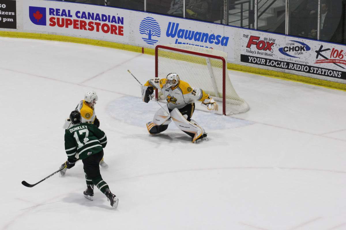Nathan Dunkley (17) of the London Knights watches his wrist shot go off the blocker of Sting goaltender Ethan Langevin in a game between the Knights and Sarnia on Dec. 12, 2018. 