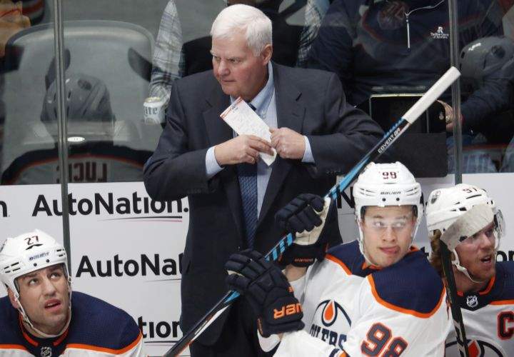 Edmonton Oilers head coach Ken Hitchcock looks on against the Colorado Avalanche in the first period of an NHL hockey game Tuesday, Dec. 11, 2018, in Denver.