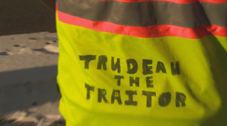 The back of a protester's jacket at the Manitoba legislature on Saturday morning.