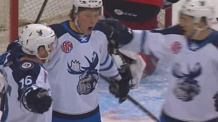 Manitoba Moose forward Austin Carroll celebrates his first goal with the team on Friday against the Grand Rapids Griffins.