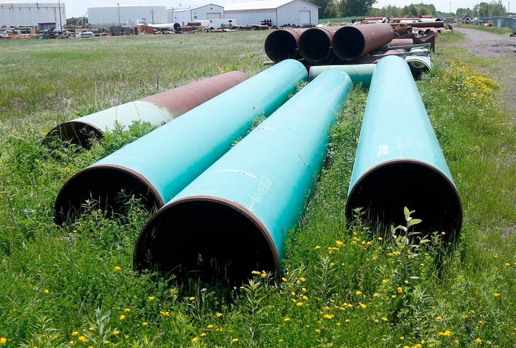 FILE - In this June 29, 2018 file photo, pipeline used to carry crude oil is shown at the Superior terminal of Enbridge Energy in Superior, Wis. On Friday, Dec. 21, 2018, Minnesota gov. Mark Dayton's administration appealed a state regulatory panel's approval of Enbridge Energy's plan to replace its aging Line 3 oil pipeline across northern Minnesota. (AP Photo/Jim Mone).