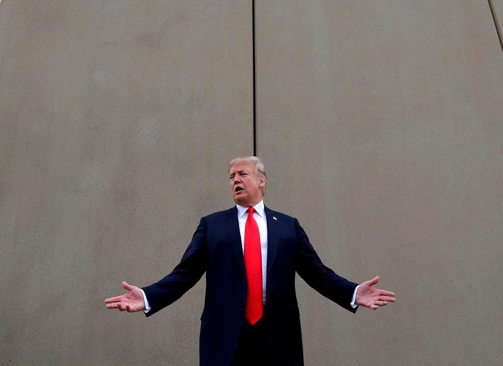 FILE - In this March 13, 2018, file photo, President Donald Trump speaks during a tour as he reviews border wall prototypes in San Diego.