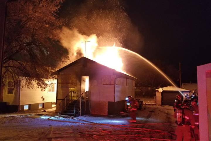 Saskatoon firefighters said flames starting coming through the roof of a home at 216 Ave. W South when they forced open the front door.