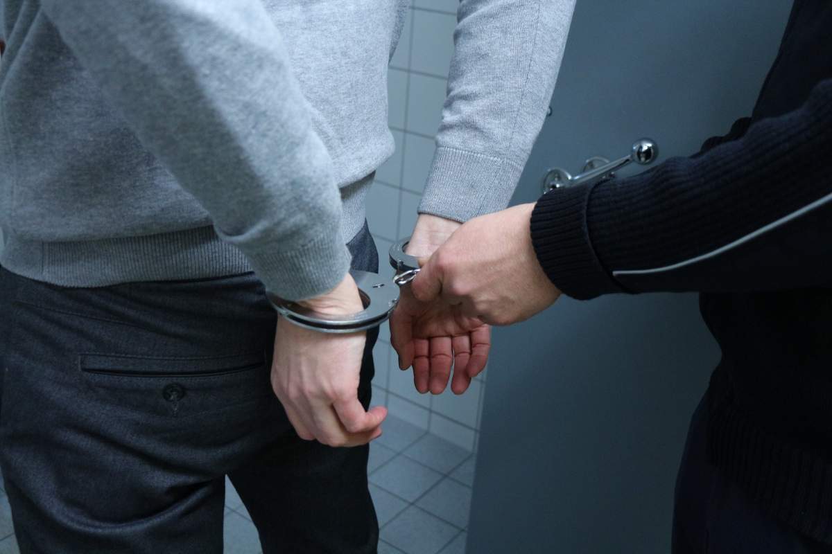A man is handcuffed.