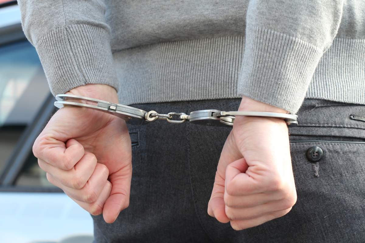 A man in handcuffs.