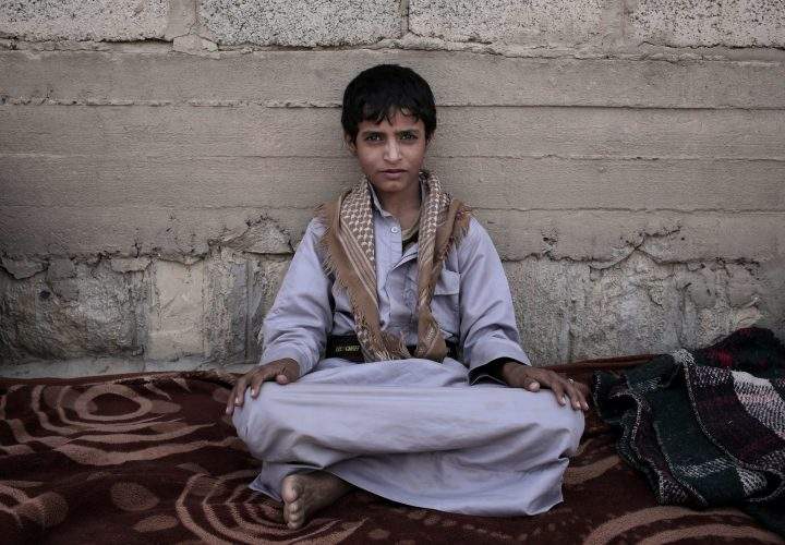 Abdel-Hamid, a 14-year-old former child soldier, poses for a photograph at a camp for displaced persons where he took shelter, in Marib, Yemen, in this July 27, 2018, photo.