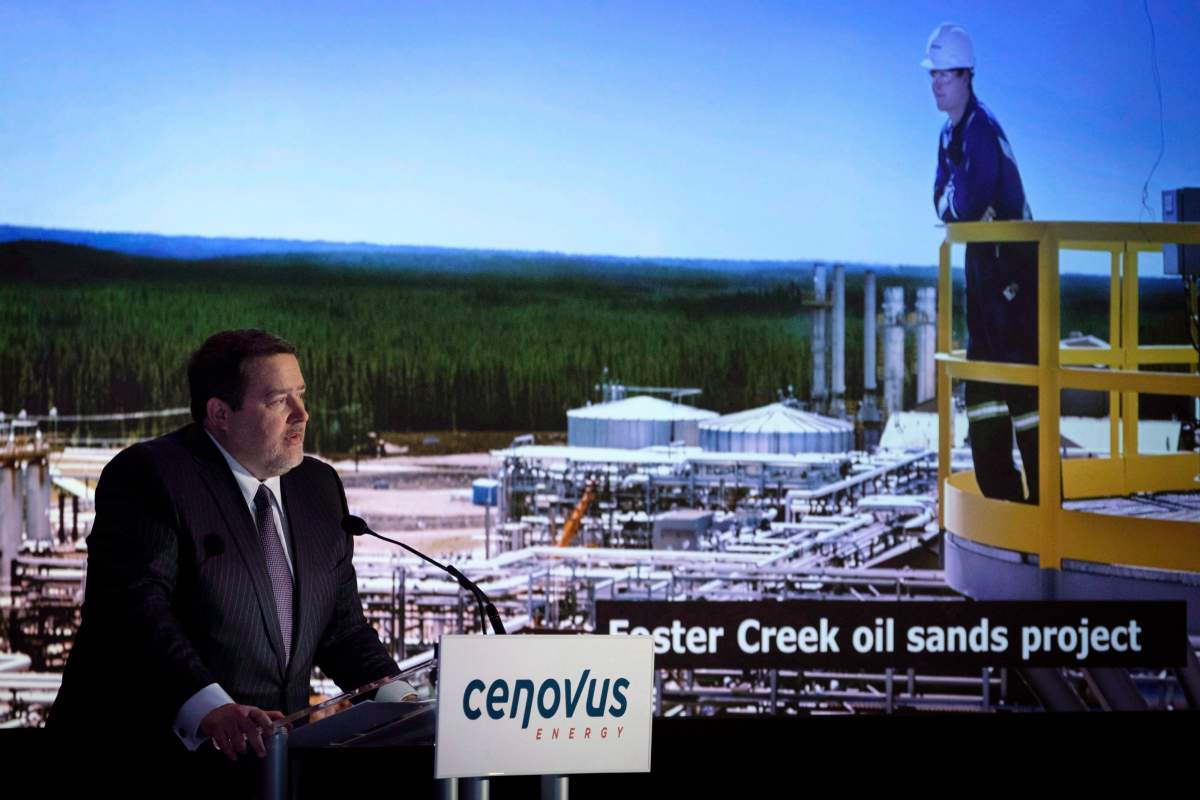 Cenovus president and CEO Alex Pourbaix, left, addresses the company's annual meeting in Calgary, Wednesday, April 25, 2018.