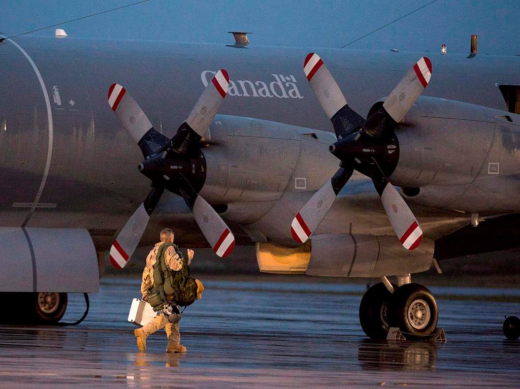 FILE - A CP-140M Aurora reconnaissance aircraft prepares to leave CFB Greenwood in Nova Scotia's Annapolis Valley on Friday, October 24, 2014.
