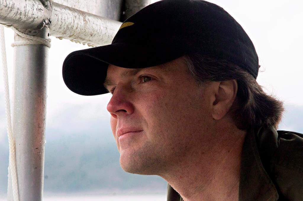 Fin Donnelly, NDP MP for New Westminister Coquitlam and Port Moody looks out from a boat at the site of the proposed Enbridge bitumen terminal on Douglas Channel, south of Kitimat, B.C., on June 27, 2012. New Democrat MP Fin Donnelly says after much thought and reflection, he will not be seeking re-election in 2019. Donnelly has represented the British Columbia riding Port Moody-Coquitlam, previously called New Westminster-Coquitlam, since 2009. THE CANADIAN PRESS/Robin Rowland.