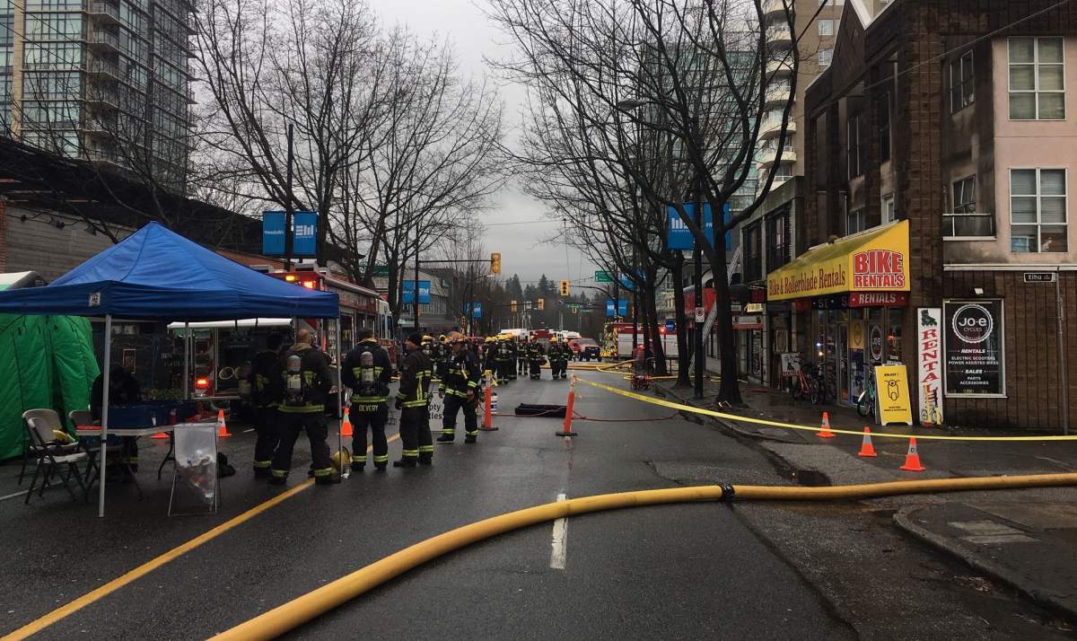 Crews on the scene of a three-alarm fire in Vancouver’s west end Sunday.