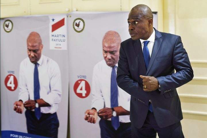 Congolese opposition presidential candidate Martin Fayulu prepares for an interview with the Associated Press in Kinshasa, Congo, Thursday Dec. 27, 2018.