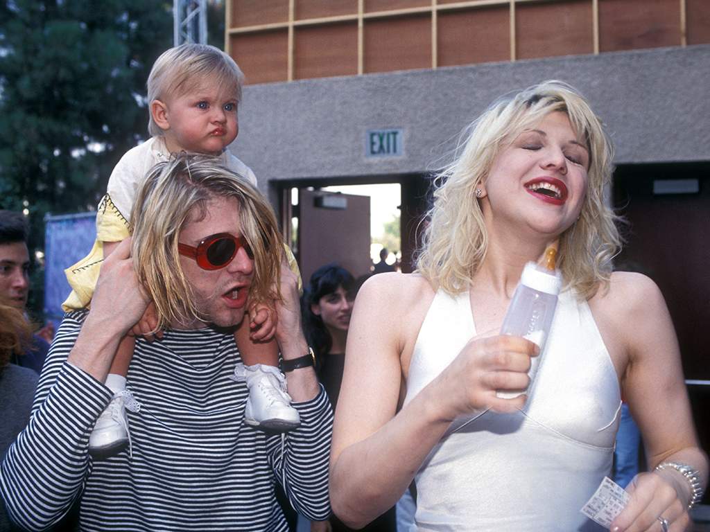 Kurt Cobain of Nirvana with wife Courtney Love and daughter Frances Bean Cobain.