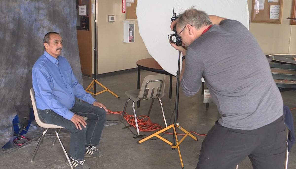 Photographer snaps a photo for Help Portrait.