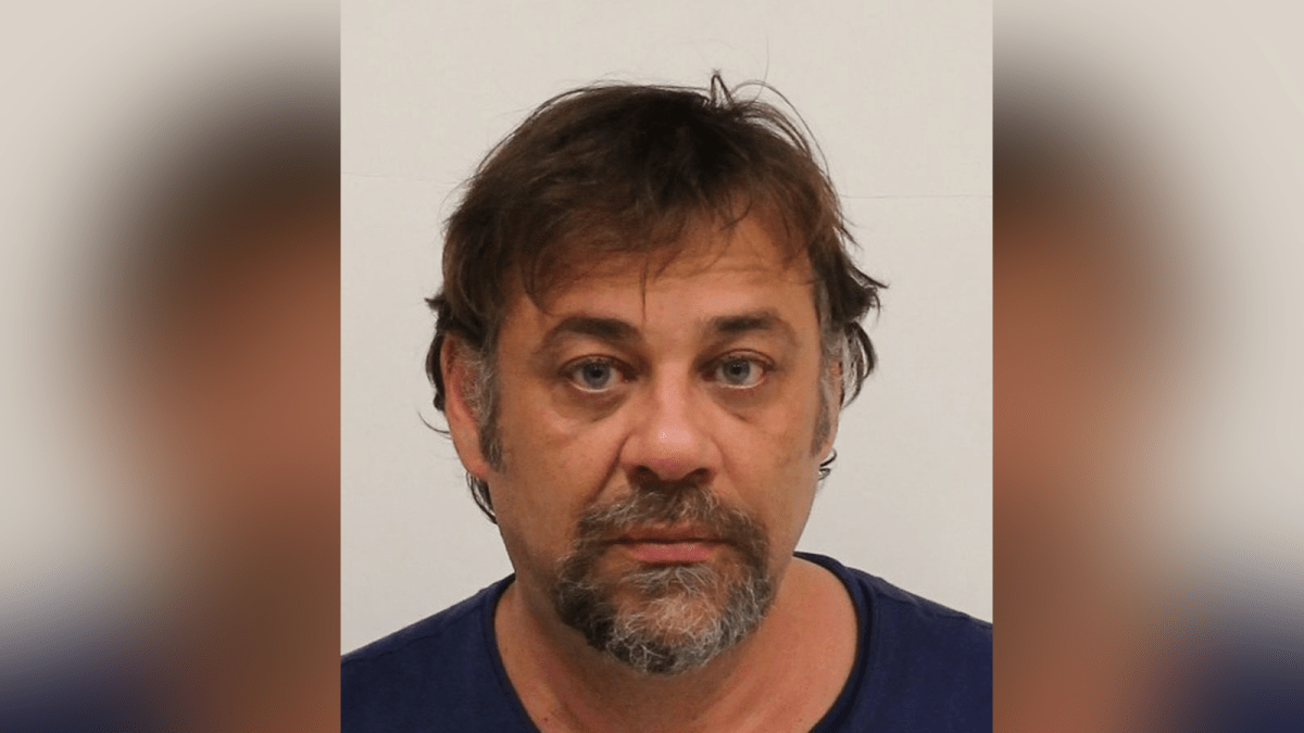 Michael Maletin, 48, has been charged with two counts of extortion and two counts of wearing a disguise with intent.