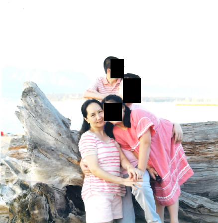 Meng Wanzhou with family on a beach.