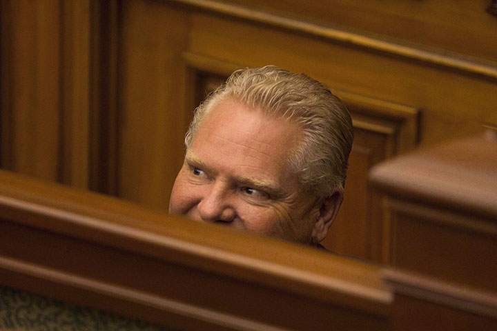 Ontario Premier Doug Ford returns to the chamber as the Ontario Legislature hold a midnight session to debate a bill that would cut the size of Toronto city council from 47 representatives to 25, in Toronto on Monday, September 17, 2018.