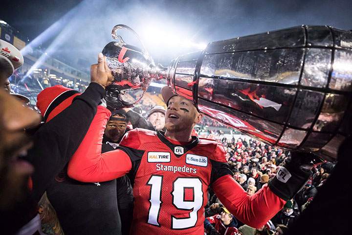 Calgary Stampeders quarterback Bo Levi Mitchell hoists the Grey Cup after defeating the Ottawa Redblacks in Edmonton, Alta., on Sunday November 25, 2018.
