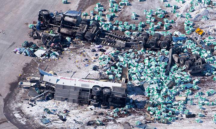 The wreckage of a fatal crash outside of Tisdale, Sask., is seen Saturday, April, 7, 2018. A bus carrying the Humbolt Broncos hockey team crashed into a truck en route to Nipawin killing 14 and sending over a dozen more to the hospital.