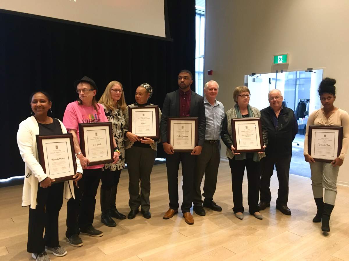 The 2018 Nova Scotia Human Rights Awards recipients show off their new hardware at the Halifax Central Library on Mon. Dec. 10, 2018.