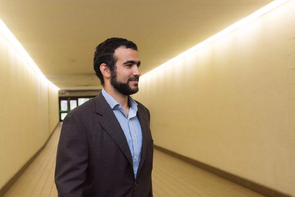 Omar Khadr leaves court after a judge ruled to relax bail conditions in Edmonton on Friday, Sept. 18, 2015. Former Guantanamo Bay detainee Omar Khadr wants to change some of the conditions of his bail, asking for a Canadian passport to travel to Saudi Arabia and requesting phone contact with his controversial sister. 