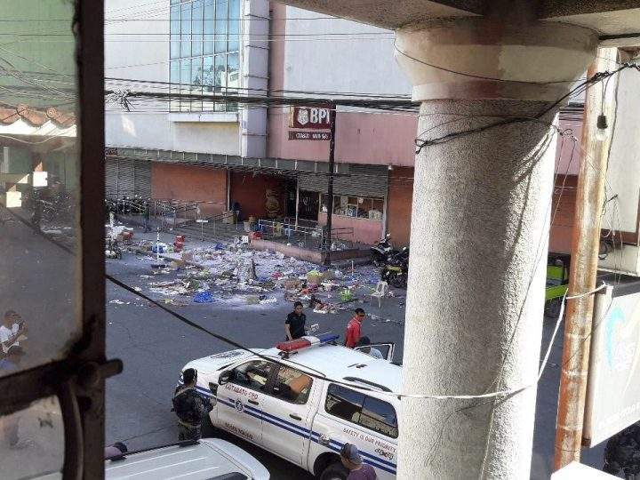 National Police investigators examine the site at the South Seas Mall following an explosion on New Year’s Eve in Cotabato city, southern Philippines Monday, Dec. 31, 2018.