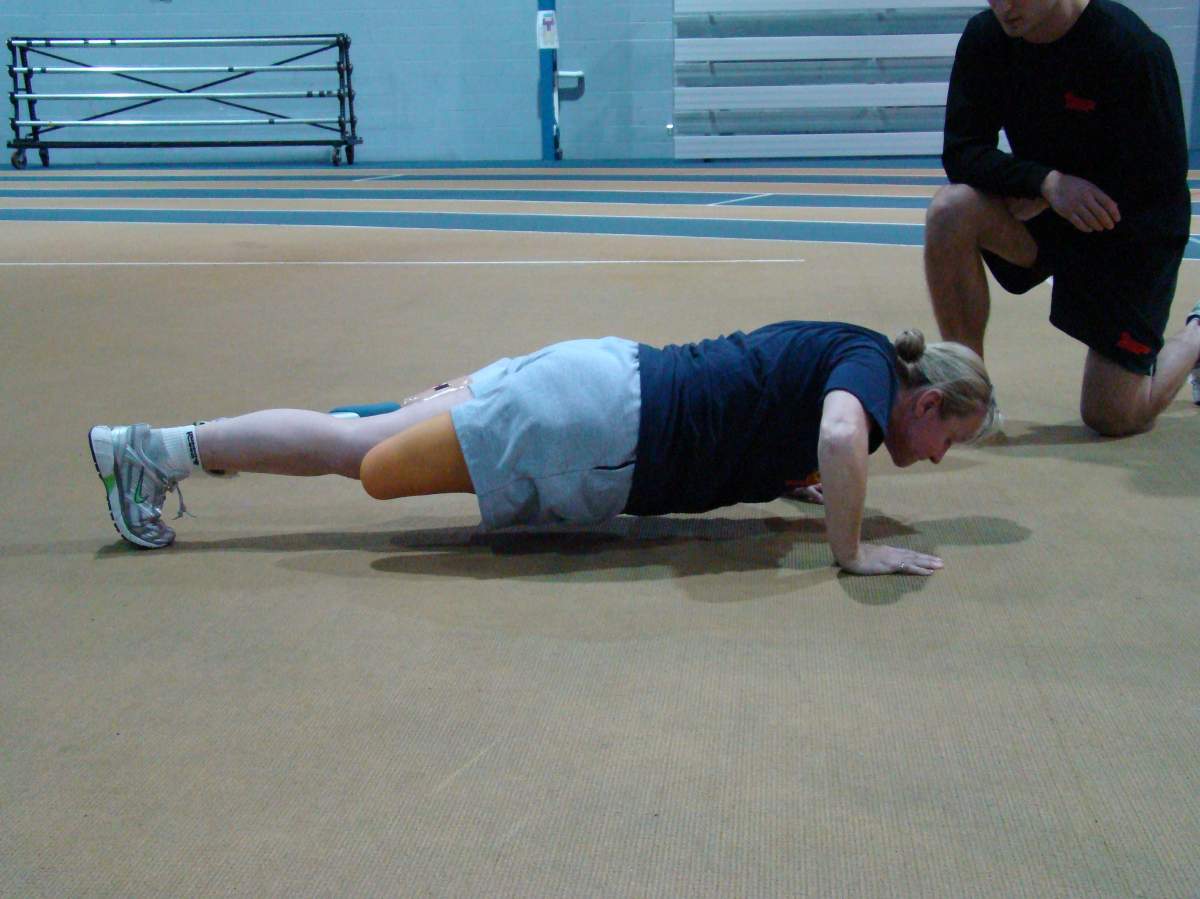 Capt. Kimberly Fawcett does a pushup.