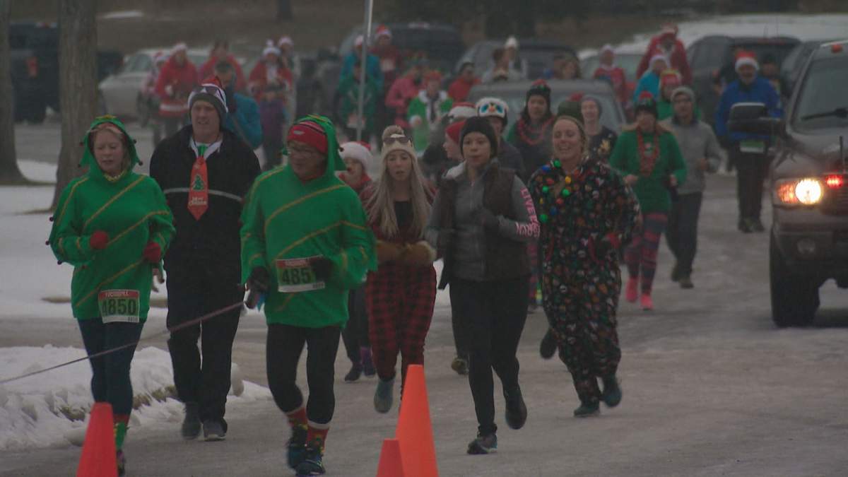 Runners take part in the Santa Shuffle at Hawrelak Park.