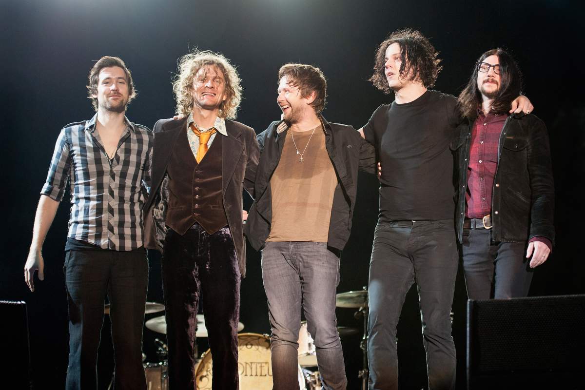 The Raconteurs gather at the end of their set at the 2011 Voodoo Experience at City Park on Oct. 30, 2011, in New Orleans, La.