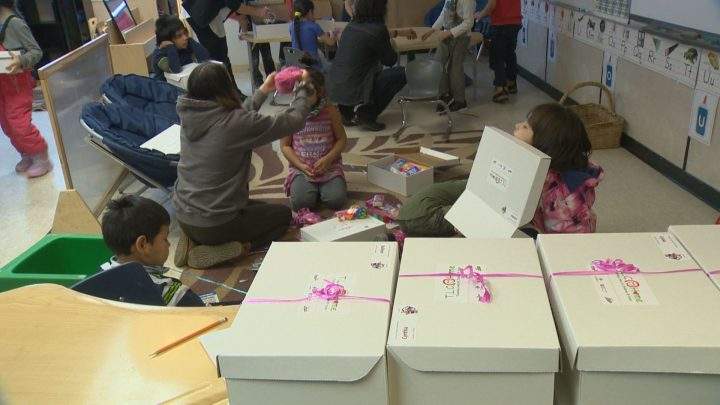 Each child receives a gift with their name on it.