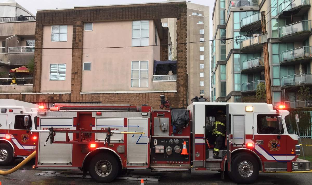 Crews on the scene of a three-alarm fire in Vancouver\’s west end Dec. 23, 2018.