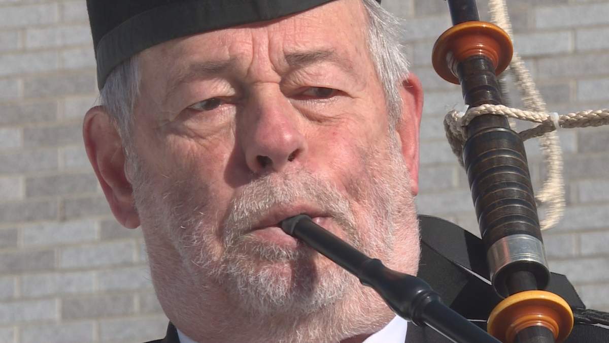 Sandy Gordon plays the bagpipe in honor of Robert Burns