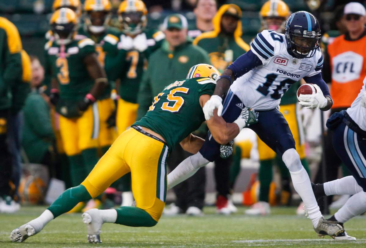 Toronto Argonauts' Armanti Edwards, right, is tackled by Edmonton Eskimos' Korey Jones during first half CFL football action in Edmonton, Saturday, Oct. 14, 2017. https://axis-monolith.live/news/4865092/eskimos-sign-three-players/.