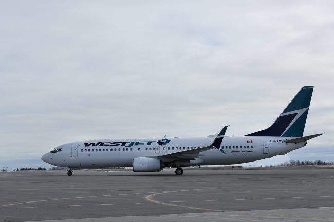 A WestJet Boeing 737 sits on the tarmac at Ottawa International airport in Ottawa, Ontario, March 11, 2018. 