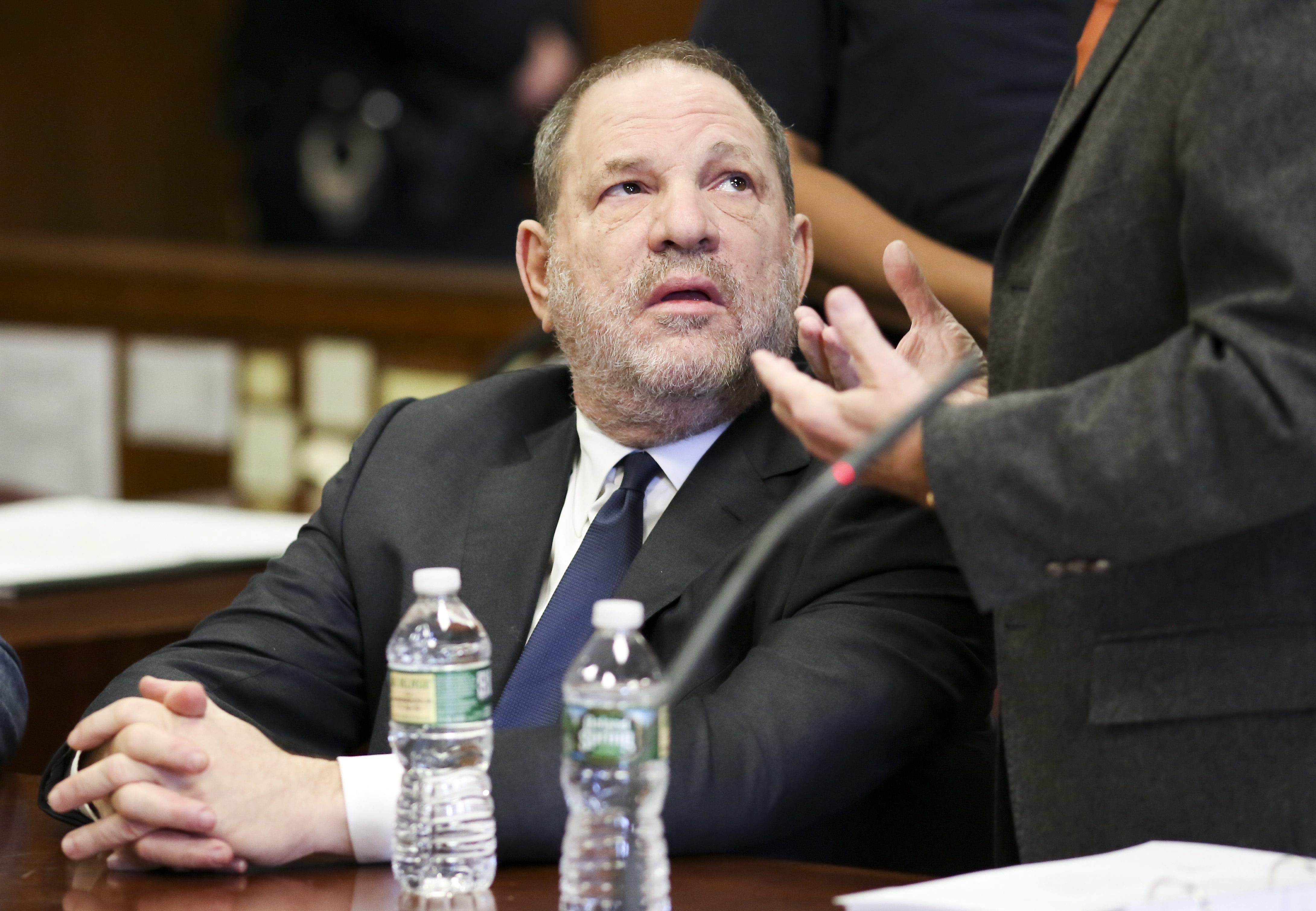 Disgraced movie producer Harvey Weinstein talks with his attorneys in a Manhattan criminal courtroom during a hearing in his sexual assault case in New York, N.Y., Dec. 20, 2018.