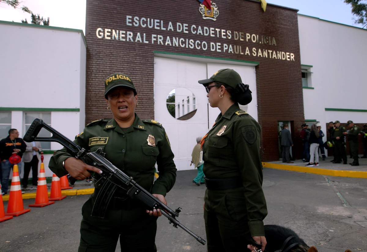 Members of the Police are seen where a bomb car caused an explosion at the Escuela General Santander de la Policia (Santander General Police School) in Bogota, Colombia.