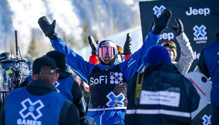 Canada's Mark McMorris raises his arms after seeing his winning score from this third run in the men's snowboard slopestyle final at the X Games on Saturday, Jan. 26, 2019, in Aspen, Colo.