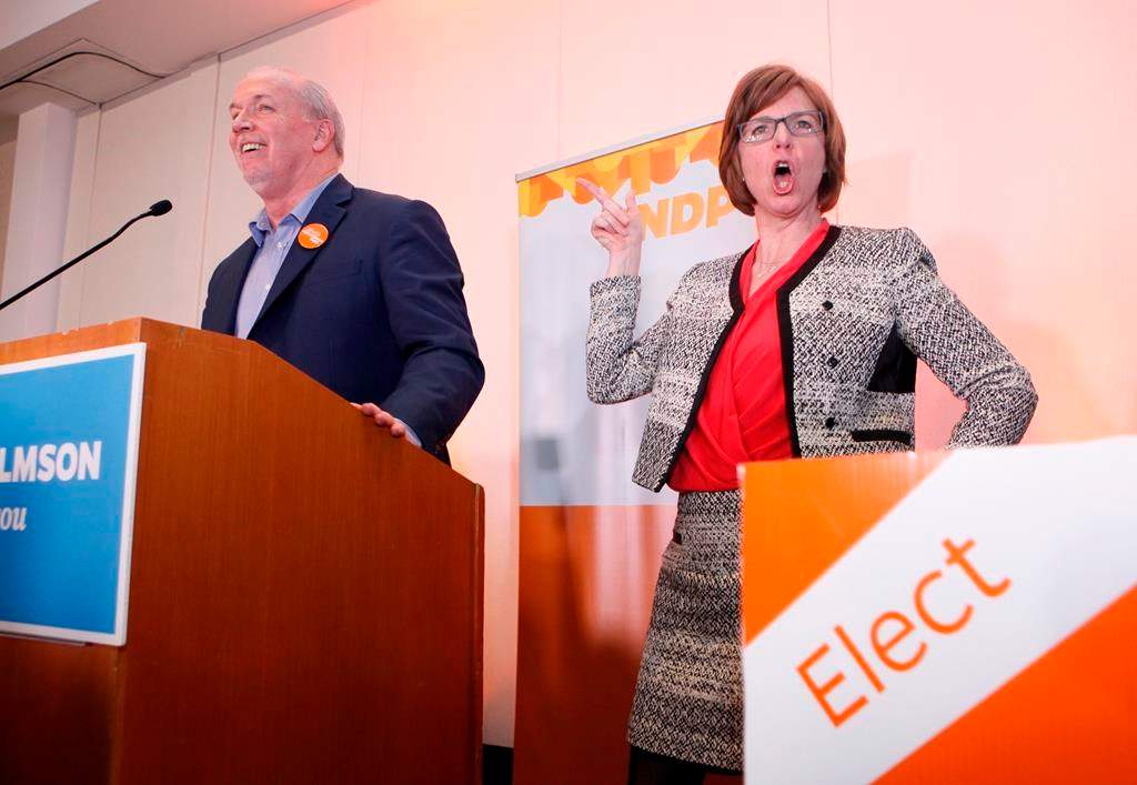 NDP candidate Sheila Malcolmson celebrates with Premier John Horgan after winning the byelection in Nanaimo, B.C., on Wednesday, January 30, 2019. The New Democrats won a key provincial byelection in British Columbia on Wednesday that allows Premier John Horgan\’s minority government to maintain its grip on power.
