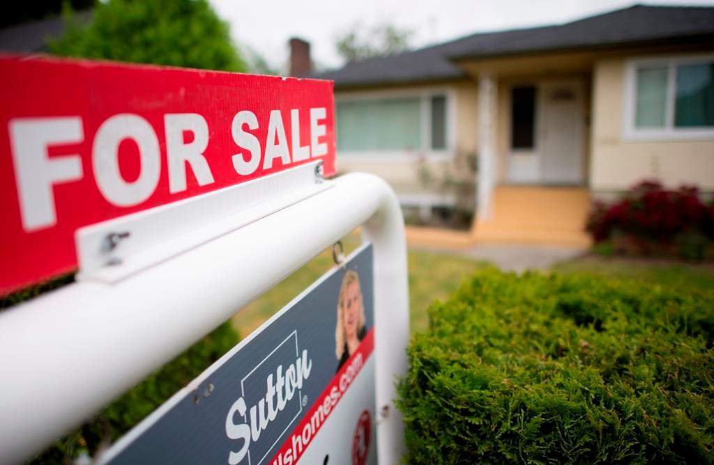 A real estate sign is pictured in Vancouver, B.C., Tuesday, June 12, 2018.