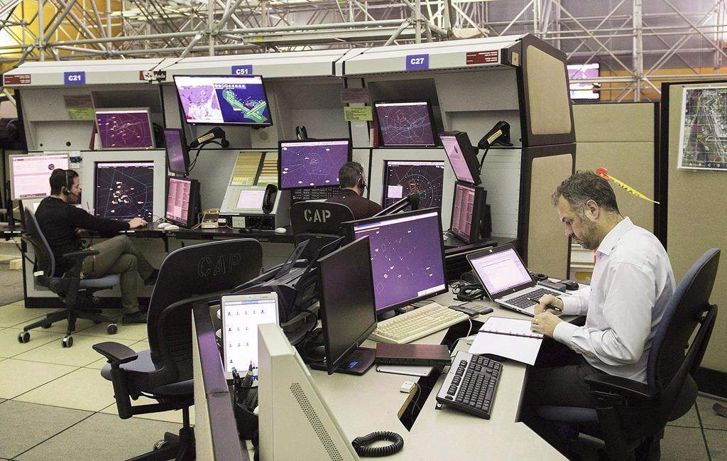 NAV Canada air traffic controllers monitor air traffic at the NAV Canada control centre in Montreal on March 2, 2018.