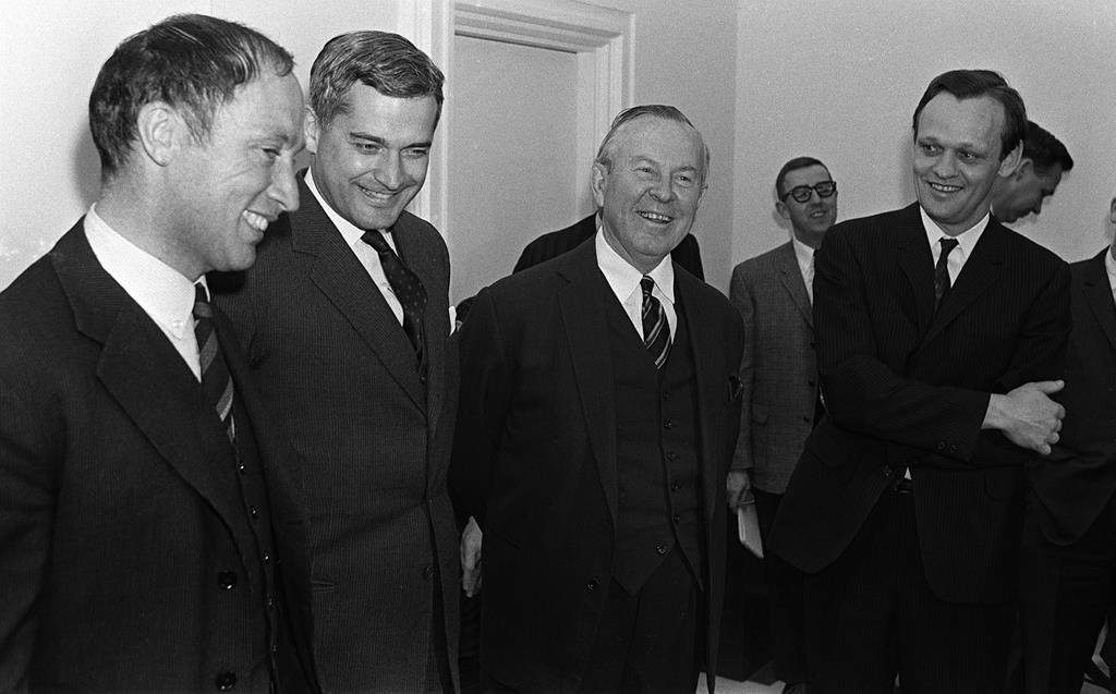 Prime Minister Lester B. Pearson (second right) and cabinet ministers Pierre Trudeau (left to right) John Turner, and Jean Chretien talk in Ottawa on April 4, 1967. THE CANADIAN PRESS/Chuck Mitchell.