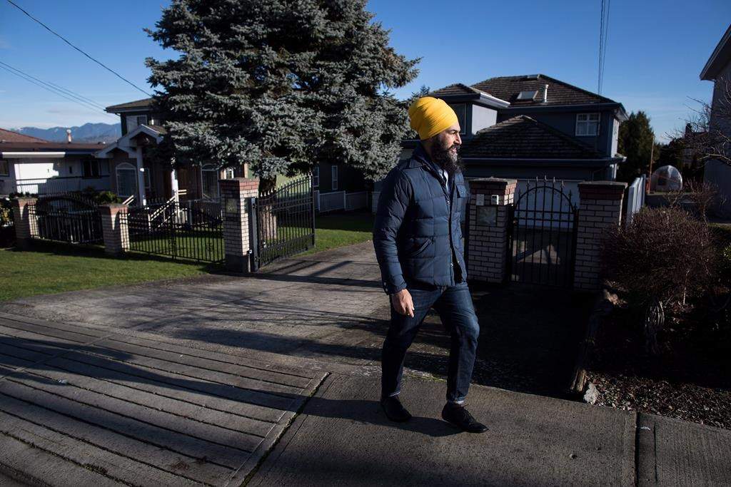 NDP Leader Jagmeet Singh door knocks for his byelection campaign, in Burnaby, B.C., on January 12, 2019. Housing is shaping up to be a defining issue in the byelection, set for Feb. 25, and in the federal election later this year. In Burnaby, renters have been kicked out of older apartments to make way for luxury condos, and sky-high prices are shutting millennials out of the market. THE CANADIAN PRESS/Darryl Dyck.