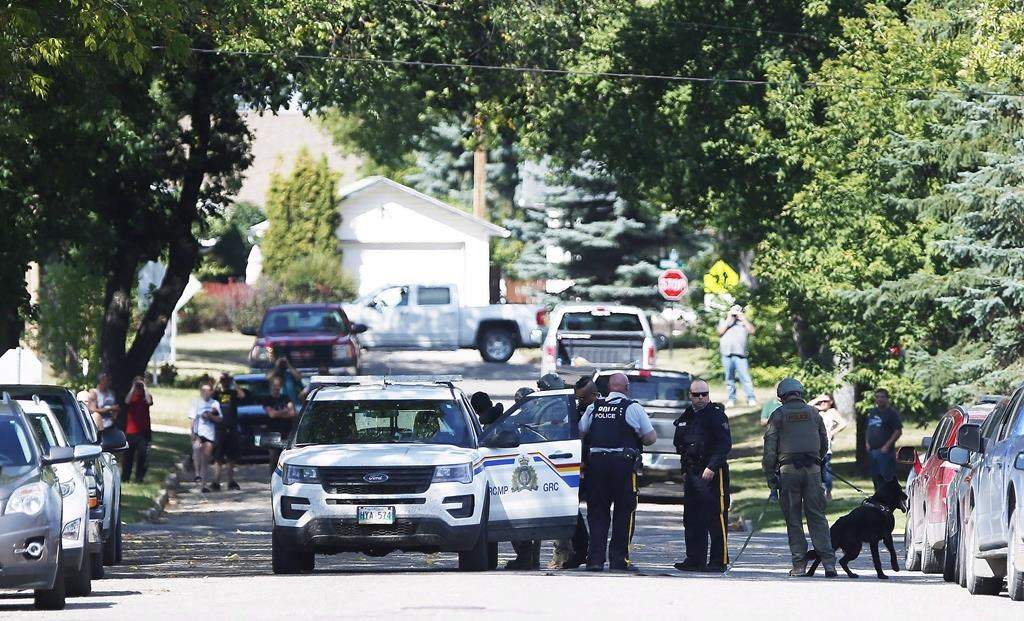 The RCMP emergency response unit arrests an alleged suspect in Neepawa, Man., August 30, 2018, following the shooting of a RCMP officer in Onanole, Man.