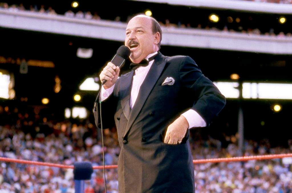 In this July 31, 1988 photo, “Mean” Gene Okerlund addresses the crowd before a pro wrestling event in Milwaukee.