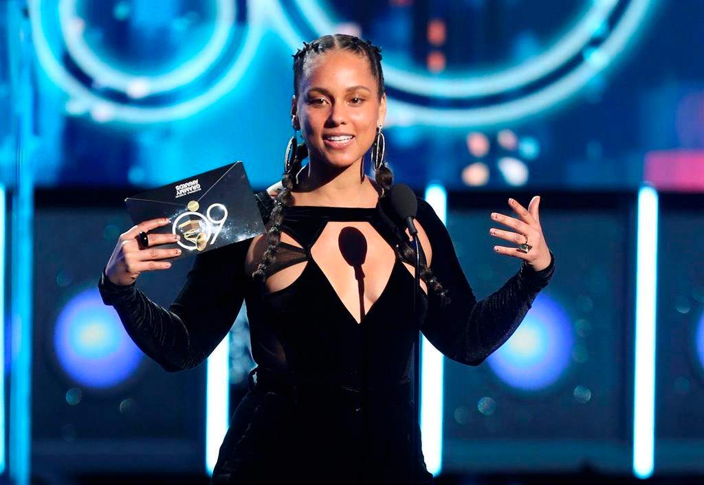 In this Jan. 28, 2018 file photo, Alicia Keys presents the award for record of the year at the 60th annual Grammy Awards at Madison Square Garden in New York.